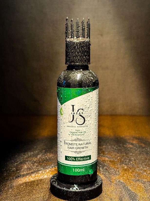 Herbal hair oil with water droplets